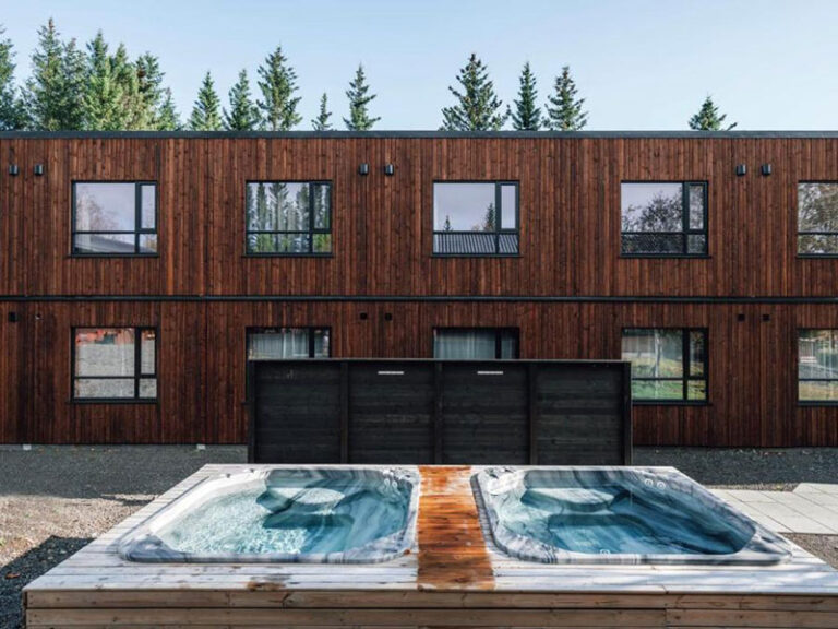 Exterior of the Blue Hotel with its hot tubs